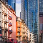 Colorful historic and modern skyscrapers in an urban cityscape.