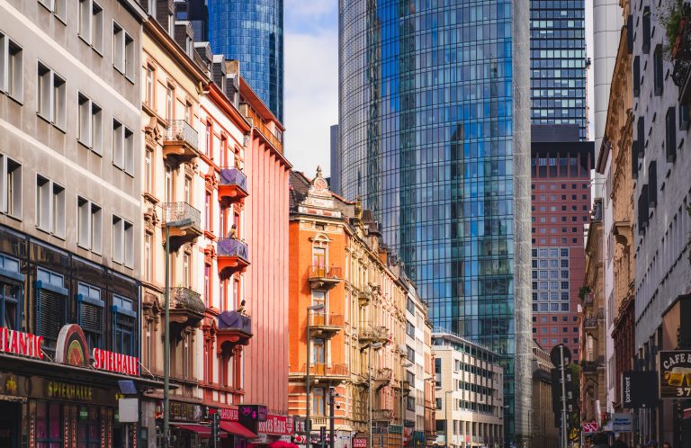 Colorful historic and modern skyscrapers in an urban cityscape.