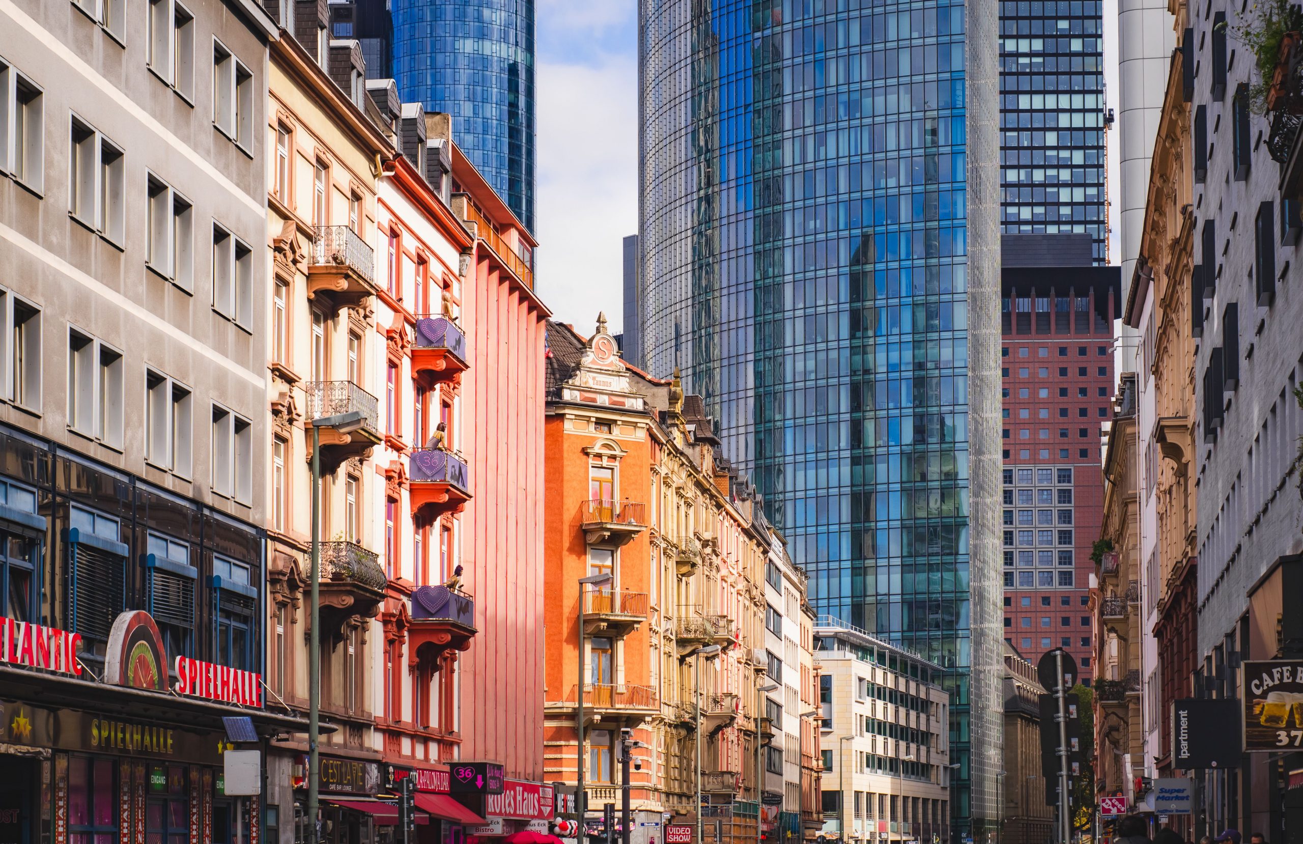 Colorful historic and modern skyscrapers in an urban cityscape.